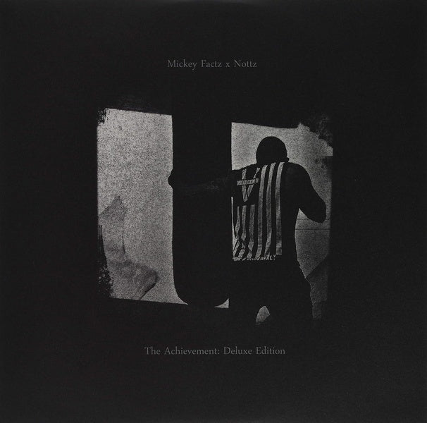 The Achievement Deluxe - Front Cover