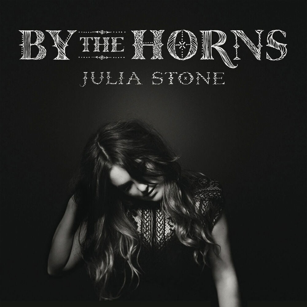 By the horns - Front Cover