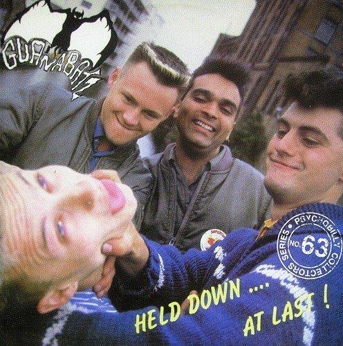 Held Down… At Last! - Front Cover